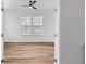 Bright bedroom with a ceiling fan and hardwood floors. A large window brings in plenty of light at 1728 Refuge Dr, Ladson, SC 29456