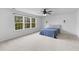 Bright bedroom with large windows and ceiling fan at 1728 Refuge Dr, Ladson, SC 29456
