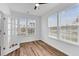 Bedroom with hardwood floors, a ceiling fan, and two windows at 1728 Refuge Dr, Ladson, SC 29456