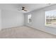 Bedroom featuring light carpet and two windows offering plenty of natural light at 1728 Refuge Dr, Ladson, SC 29456