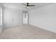 Spacious bedroom with neutral carpet, ceiling fan, and double closet doors at 1728 Refuge Dr, Ladson, SC 29456