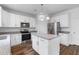 Bright kitchen with stainless steel appliances, island, and granite countertops at 1728 Refuge Dr, Ladson, SC 29456