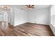 Bright, open living room features hardwood floors, ceiling fan, and ample natural light at 1728 Refuge Dr, Ladson, SC 29456