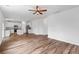 Open-concept living room flows into the kitchen with hardwood floors at 1728 Refuge Dr, Ladson, SC 29456