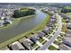 Aerial view of the neighborhood showcasing pond access, nearby trees, and residential street at 183 Greenwich Dr, Summerville, SC 29486