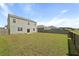 Expansive backyard featuring a well-maintained lawn and a wooden fence that encloses the property at 183 Greenwich Dr, Summerville, SC 29486