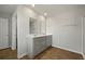 Bathroom with double sink vanity and wood-look flooring at 183 Greenwich Dr, Summerville, SC 29486