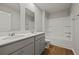 Bright bathroom featuring double sinks, wood flooring, shower, and a bathtub at 183 Greenwich Dr, Summerville, SC 29486