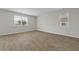 A well-lit bedroom showcases wood flooring and two large windows at 183 Greenwich Dr, Summerville, SC 29486