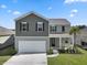 Charming two-story home featuring a two-car garage and beautifully landscaped front yard at 183 Greenwich Dr, Summerville, SC 29486