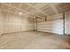 Unfinished two-car garage interior view showing the concrete slab and door assembly at 183 Greenwich Dr, Summerville, SC 29486