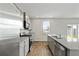 Modern kitchen with stainless steel appliances, gray cabinets, and granite countertops, designed for functionality at 183 Greenwich Dr, Summerville, SC 29486