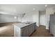 Kitchen island with granite countertops, stainless steel appliances, and hardwood floors that offers a modern look at 183 Greenwich Dr, Summerville, SC 29486