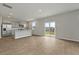 Bright, open-concept space with hardwood floors, stainless steel appliances, and sliding door to the backyard at 183 Greenwich Dr, Summerville, SC 29486