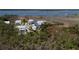 Aerial view of waterfront homes with coastal marsh views, showcasing the neighborhood's prime location and serene setting at 1905 Lone Oak Pt, Mount Pleasant, SC 29466