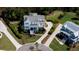 Expansive aerial view of a coastal home surrounded by lush landscaping and manicured lawns, showcasing its prime location at 1905 Lone Oak Pt, Mount Pleasant, SC 29466