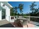 Inviting back deck with outdoor seating overlooking a lush, wooded backyard at 1905 Lone Oak Pt, Mount Pleasant, SC 29466