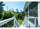 Stairway leading to a well-maintained backyard with green grass and lush landscaping at 1905 Lone Oak Pt, Mount Pleasant, SC 29466