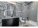 Charming bathroom featuring unique wallpaper, a granite countertop, and a shower-tub combination at 1905 Lone Oak Pt, Mount Pleasant, SC 29466