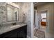 Charming bathroom featuring granite countertops, floral wallpaper, and stylish fixtures, offering a blend of modern and classic design at 1905 Lone Oak Pt, Mount Pleasant, SC 29466