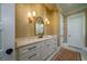 Bathroom featuring a vanity with marble counters, and elegant lighting fixtures at 1905 Lone Oak Pt, Mount Pleasant, SC 29466