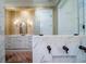 Open concept view of the marble shower and vanity area with marble counters at 1905 Lone Oak Pt, Mount Pleasant, SC 29466