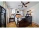 Cozy bedroom with a ceiling fan, plantation shutters, and elegant furnishings for a relaxing retreat at 1905 Lone Oak Pt, Mount Pleasant, SC 29466