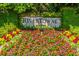 Rivertowne established in 1996 sign with colorful flowers and greenery at 1905 Lone Oak Pt, Mount Pleasant, SC 29466