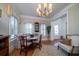 Inviting dining area with built-in bench, plantation shutters, and elegant décor, perfect for gatherings at 1905 Lone Oak Pt, Mount Pleasant, SC 29466