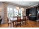 Bright dining room with stylish furnishings, natural light, and built-in cabinets at 1905 Lone Oak Pt, Mount Pleasant, SC 29466