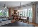 Elegant dining room with natural light, modern lighting, and hardwood floors at 1905 Lone Oak Pt, Mount Pleasant, SC 29466