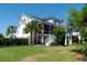 Charming two-story home with a spacious lawn, screened in porch, and a beautiful garden, perfect for outdoor living at 1905 Lone Oak Pt, Mount Pleasant, SC 29466