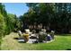 Outdoor fire pit area with comfortable seating perfect for entertaining or relaxing by the fire at 1905 Lone Oak Pt, Mount Pleasant, SC 29466