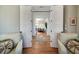 Elegant foyer view through double doors showcasing hardwood floors and a welcoming atmosphere at 1905 Lone Oak Pt, Mount Pleasant, SC 29466
