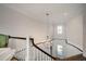 Elegant foyer showcasing a chandelier and winding staircase with dark wood railings at 1905 Lone Oak Pt, Mount Pleasant, SC 29466