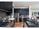 Spacious kitchen with stainless steel appliances, dark cabinets, and a central island with a sink at 1905 Lone Oak Pt, Mount Pleasant, SC 29466