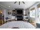 Relaxing living room with a fireplace, window views, built-in shelving, and comfortable seating at 1905 Lone Oak Pt, Mount Pleasant, SC 29466