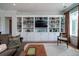 Elegant living room featuring a custom built-in shelving unit and comfortable seating at 1905 Lone Oak Pt, Mount Pleasant, SC 29466