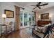 Cozy living room featuring a decorative rug, armchairs, and sliding glass doors at 1905 Lone Oak Pt, Mount Pleasant, SC 29466