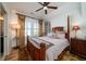 Elegant bedroom with a four-poster bed, plantation shutters, and sophisticated decor, perfect for relaxation at 1905 Lone Oak Pt, Mount Pleasant, SC 29466