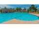 A community pool that features lounge chairs, a covered pavilion, and many umbrellas for shade at 1905 Lone Oak Pt, Mount Pleasant, SC 29466