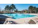 A beautiful community pool surrounded by lots of lounge chairs with covered pavilions at 1905 Lone Oak Pt, Mount Pleasant, SC 29466