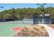 A community tennis court that is fenced in by trees at 1905 Lone Oak Pt, Mount Pleasant, SC 29466