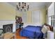 Bedroom with wood flooring, blue bedspread, and decorative chandelier at 197 Coming St, Charleston, SC 29403