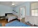 A bedroom featuring blue accent rug, overhead fan, and access to stairs at 197 Coming St, Charleston, SC 29403