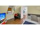 Cozy bedroom with hardwood floors, bed, beanbag, window AC unit and TV at 197 Coming St, Charleston, SC 29403