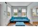 Cozy living room with a comfortable blue sofa, wooden floors and natural light from the windows at 197 Coming St, Charleston, SC 29403