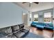 Cozy living room featuring blue walls, hardwood floors, and comfortable seating at 197 Coming St, Charleston, SC 29403