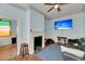 Bright living room with a fireplace, TV, and ceiling fan at 197 Coming St, Charleston, SC 29403