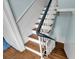 Wooden staircase with white railings and a vintage aesthetic at 197 Coming St, Charleston, SC 29403